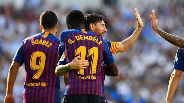 Leo Messi embraces match-winner Ousmane Dembele