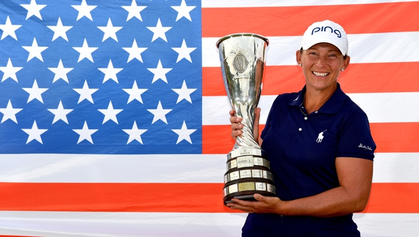 Angela Stanford of the United States poses with the trophy after her victory in the Evian Championship
