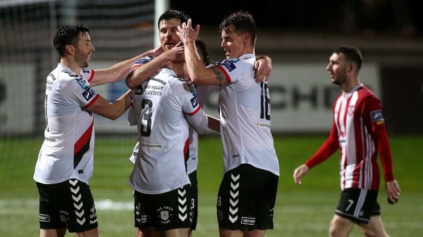 Bohemians players celebrate their success at The Brandywell