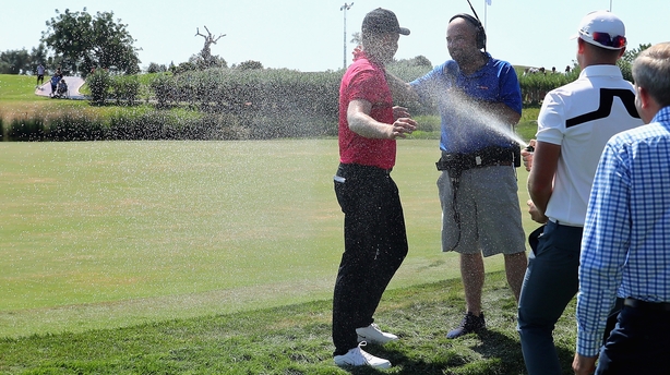 Fisher sprayed with champagne on the 18th green after his 59