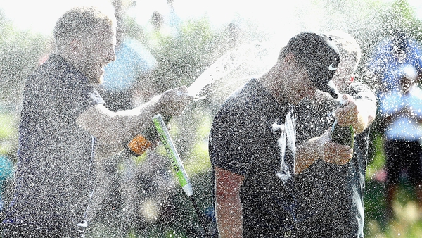 Tom Lewis is soaked with champagne after winning the Portugal Masters
