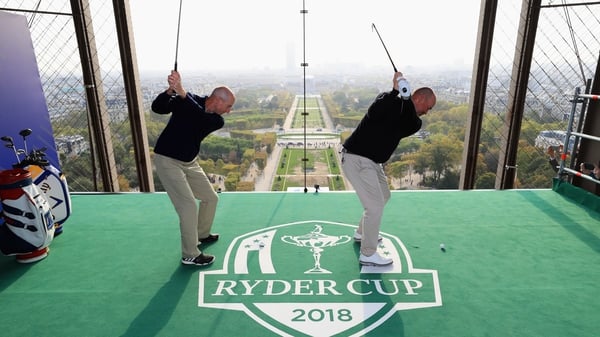 Elevated tee box - Ryder Cup captains Jim Furyk and Thomas Bjorn tee off from a platform on the Eiffel Tower