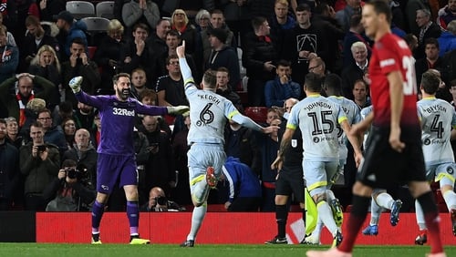 Richard Keogh leads the charge to celebrate with Scott Carson