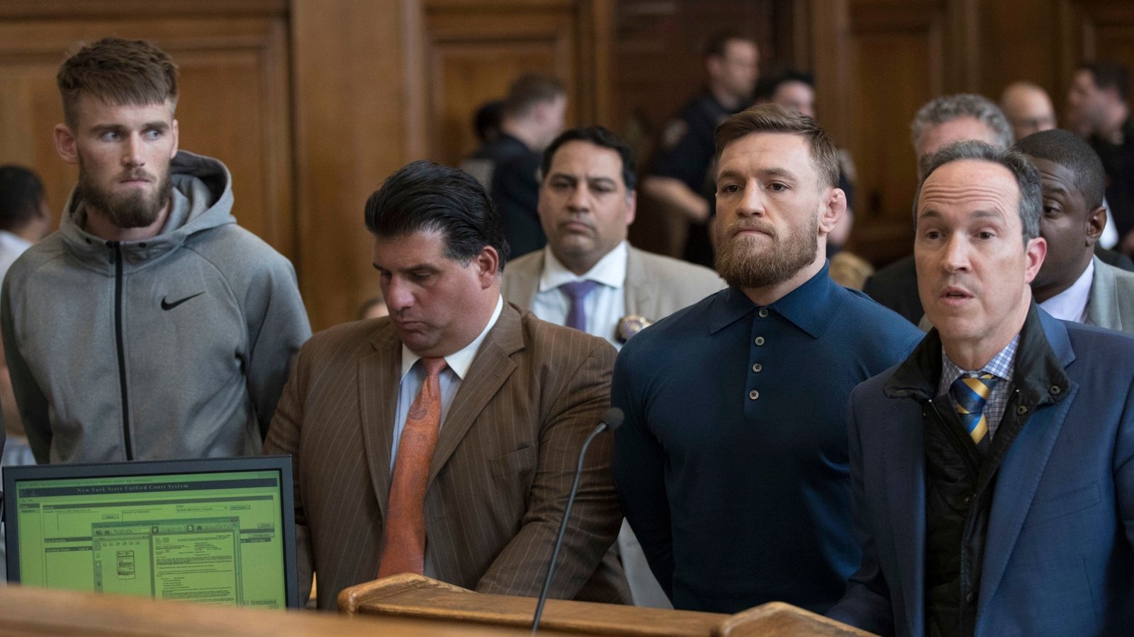 Image - McGregor next to his lawyer Jim Walden (R) in Brooklyn Criminal Court in April