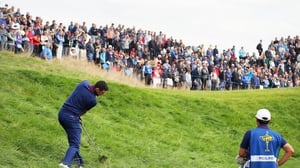 Rory McIlroy makes a recovery shot on the seventh