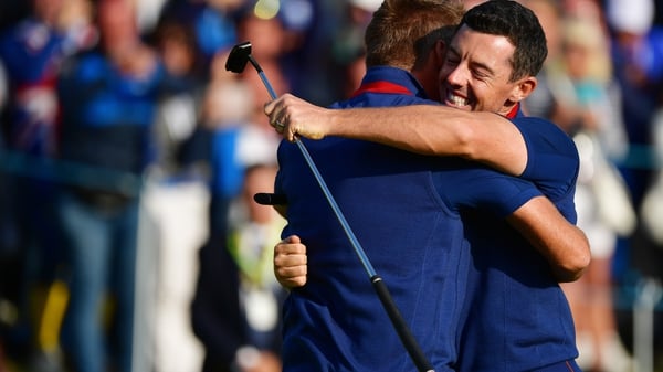 Rory McIlroy and Ian Poulter embrace in Paris
