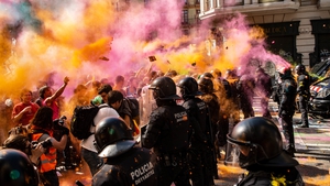 Separatist protesters threw powder paint at riot police