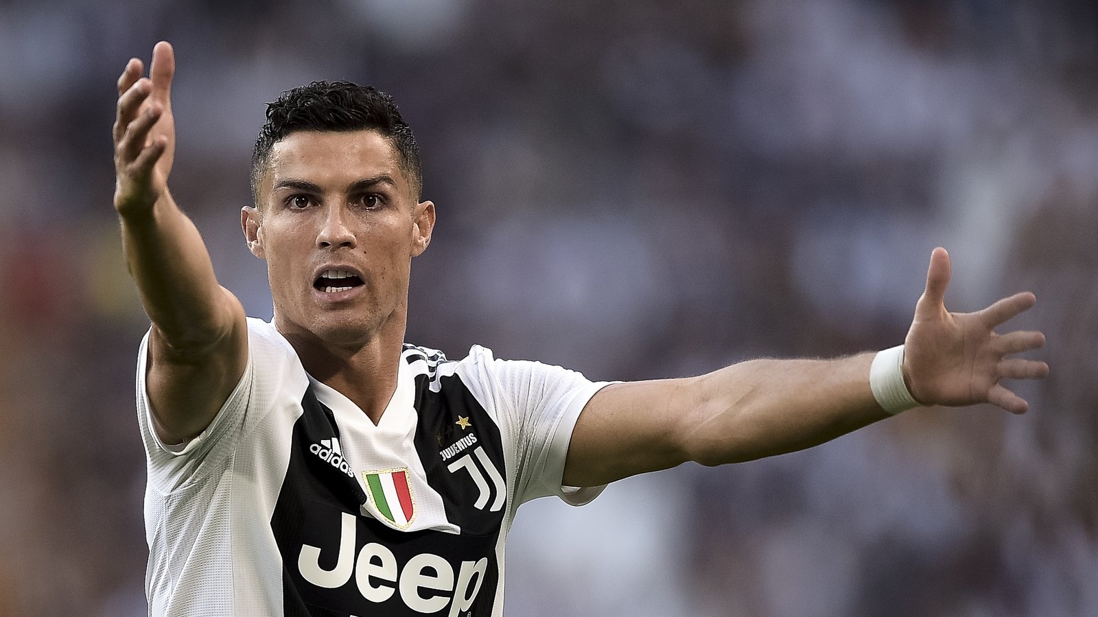 Cristiano Ronaldo of Juventus FC holds a jersey with the number 700 News  Photo - Getty Images