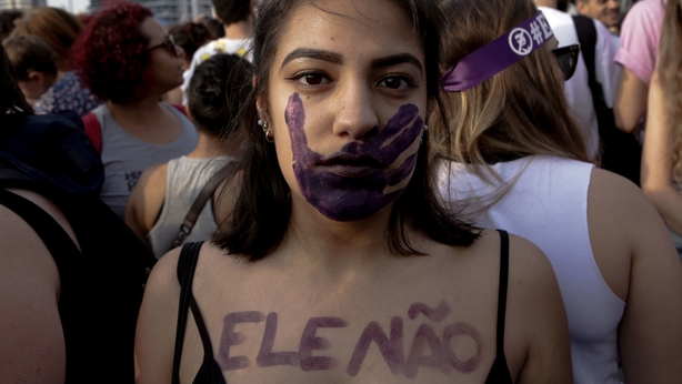 A woman protests Mr Bolsonaro on 29 September
