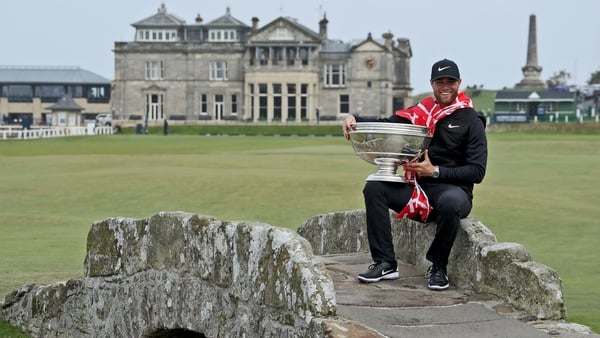 Lucas Bjerregaard poses with the trophy on the iconic Swilken Bridge at St Andrews
