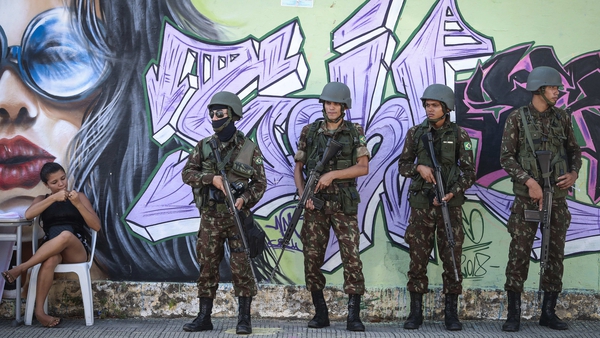 Brazilian soldiers stand guard at a polling station in Fortaleza, Brazil