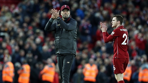 Andrew Robertson and Jurgen Klopp salute the fans after the City game