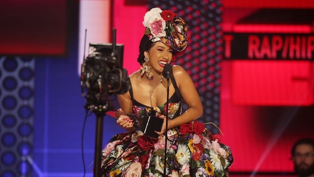 Cardi B accepts the Favorite Artist - Rap/Hip-Hop award onstage