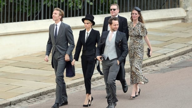 Cara Delevingne (centre) arrives for the wedding of Princess Eugenie to Jack Brooksbank (Aaron Chown/ PA)