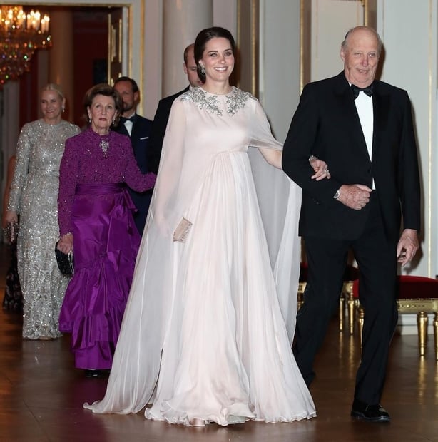 The Duchess of Cambridge is escorted into dinner by King Harald V of Norway at the Royal Palace, Oslo, Norway at the end of the third day of her tour of Scandinavia (Chris JacksonPA)