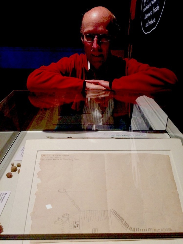 Dr. Mike Simms with a sketch of Dippy he made in 1968, when he was just 7 years old