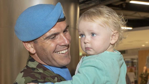 Corporal Dave Sweeney and his son Daíre at Dublin Airport