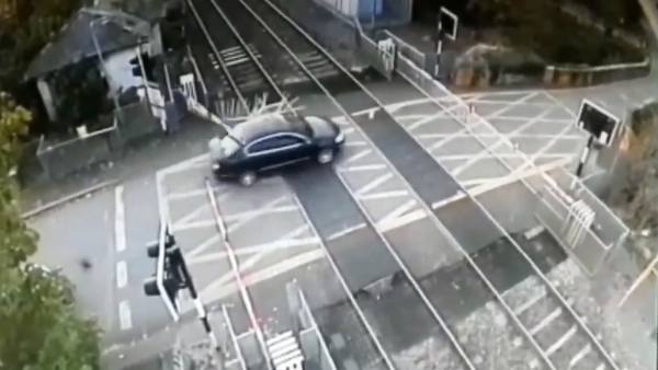 CCTV footage shows the car crashing through the crossing at Porterstown
