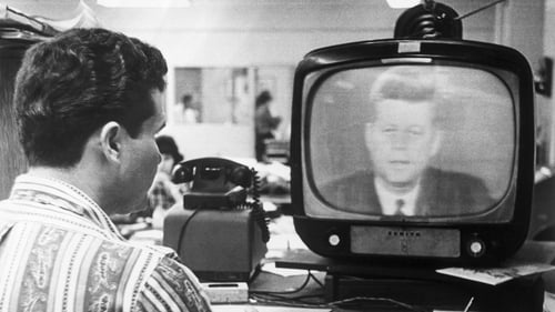 Federico Fidel Fernandez, a Miami Cuban refugee, listens to President Kennedy's television address 22nd October 1962, in which the President explained the United States' position on the Cuban situation to the American people and the world.