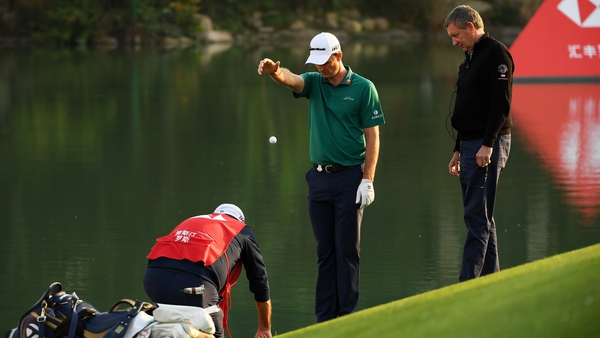 Justin Rose beside the water at 17