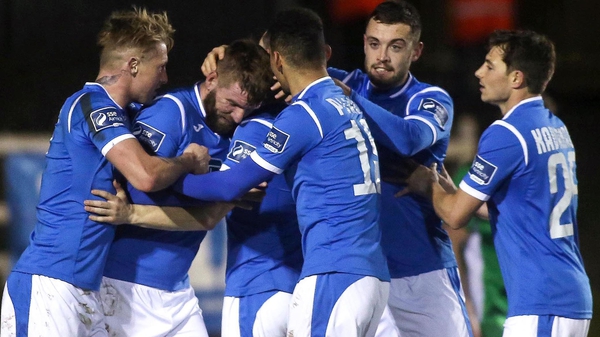 Paddy McCourt is congratulated by his team-mates after scoring
