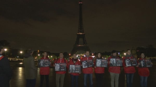 Members of French NGO Reporters Without Borders gathered in front of the Paris landmark