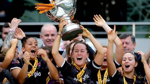 Kylie Murphy lifts the cup