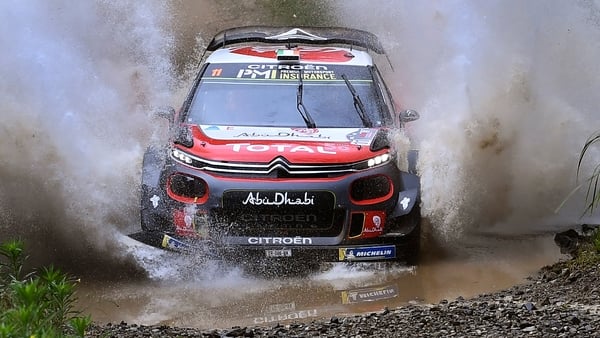 Craig Breen speeds through a creek