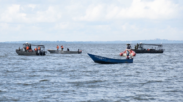 Rescue boats search the waters of Lake Victoria following the accident yesterday