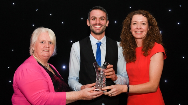 Barr being presented with his award by Georgina Drumm and Liz Rowen