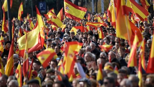 People attend a demonstration called by the far-right party VOX against Catalan separatists