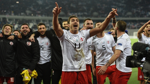 Giorgi Merebashvili and his Georgia team-mates celebrate at the end of a successful Nations League campaign
