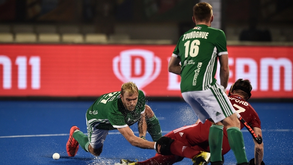 Ireland's Conor Harte battles with Liam Sanford for possession during the World Cup defeat to England