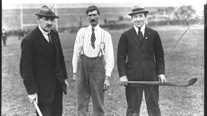 Michael Collins and Harry Boland, both elected MPs in 1918, are pictured here holding hurleys in Croke Park in 1921 (RTE Archives)