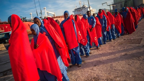 Migrants queuing for Spanish Red Cross services after their arrival at the Port of Malaga in December 2018. Photo: Getty Images