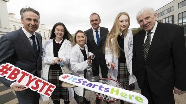 MD of BT Ireland, Shay Walsh, Minister for Education and Skills, Joe McHugh TD, and co-founder of the BTYSTE, Dr. Tony Scott with Lucan Community College students; Faye Murphy, Córa O'Toole, and Cara Phelan whose project is investigating the most effective ways for keeping teen girls in sports.