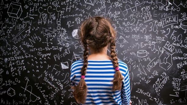 girl doing math science school
