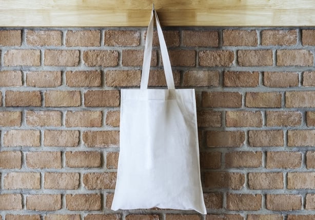 Mock up Cotton Tote Bag on Brick wall Background