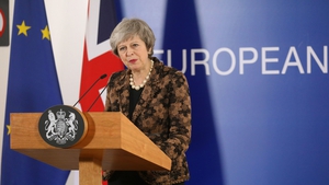 Theresa May speaking to reporters in Brussels