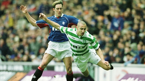 Henrik Larsson of Celtic flies through the air after a tackle from Fernando Ricksen back in 2003