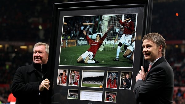 Manchester United Manager Alex Ferguson presents Ole Gunnar Solskjaer with a print of his winning goal celebration from the 1999 Champions League Final in 2010
