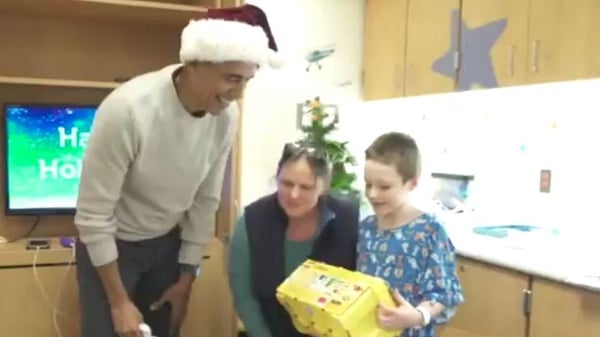 Barack Obama delighted young patients at Children's National hospital in Washington with gifts and hugs