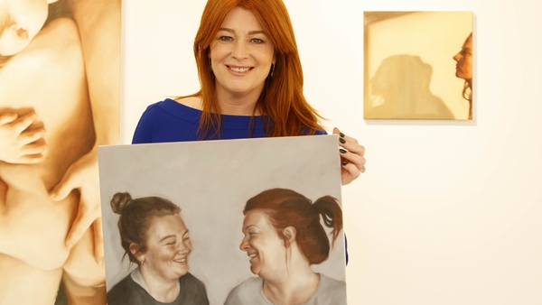 RTÉ's Bláthnaid Ní Chofaigh pictured with her portrait at the opening of Birthmarks by Dublin artist Siobhán O'Callaghan