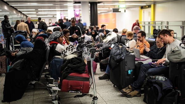 Passengers waiting at Gatwick Airport earlier this morning