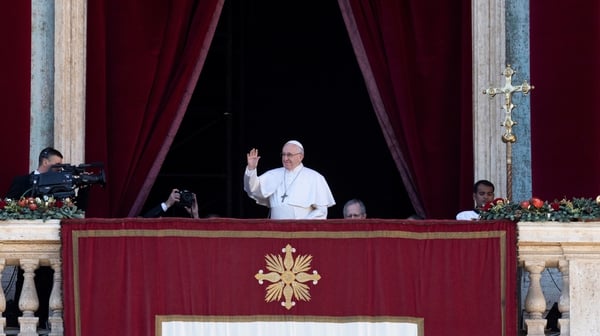 Pope Francis addressing crowds from a balcony in The Vatican
