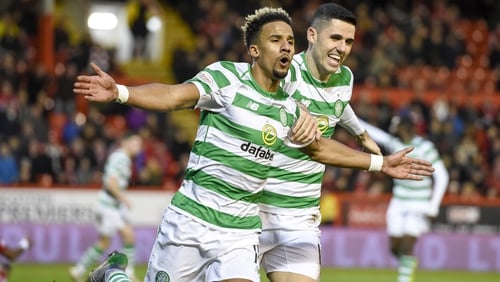 Scott Sinclair (L) celebrates with Tom Rogic after scoring his and Celtic's second goal