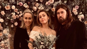 Billy Ray Cyrus at his wife Tish with their daughter Miley