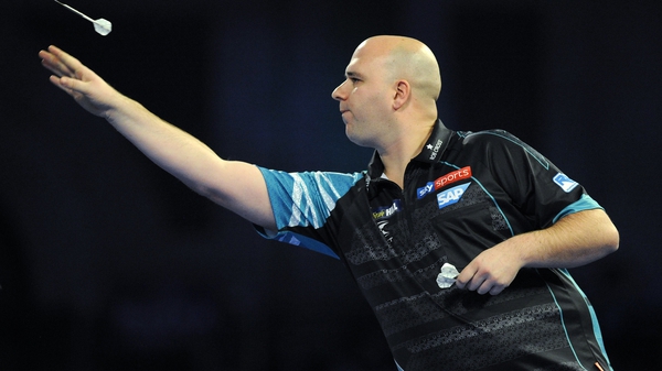 Reigning champion Rob Cross crashed out