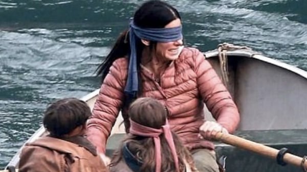 Sandra Bullock rows down the river with the children