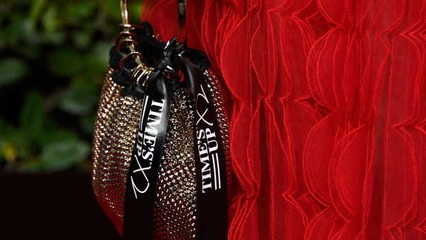 Laura Dern's bag featured ribbons bearing the 'Time's Up x 2' message